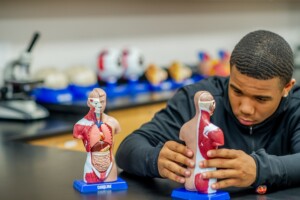 High School Student with Anatomy Model