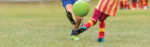 kids kicking a soccer ball