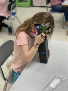 A student performs an investigation.