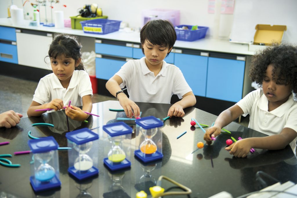 Students use manipulatives as part of their hands-on learning.