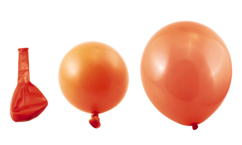 A balloon expands in a vacuum