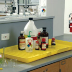 Chemicals safely stored in a chemical tray