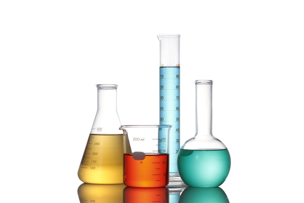 Colored solutions in laboratory glassware.