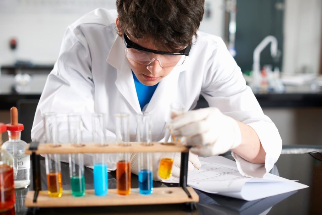 A student performs a chemistry investigation.