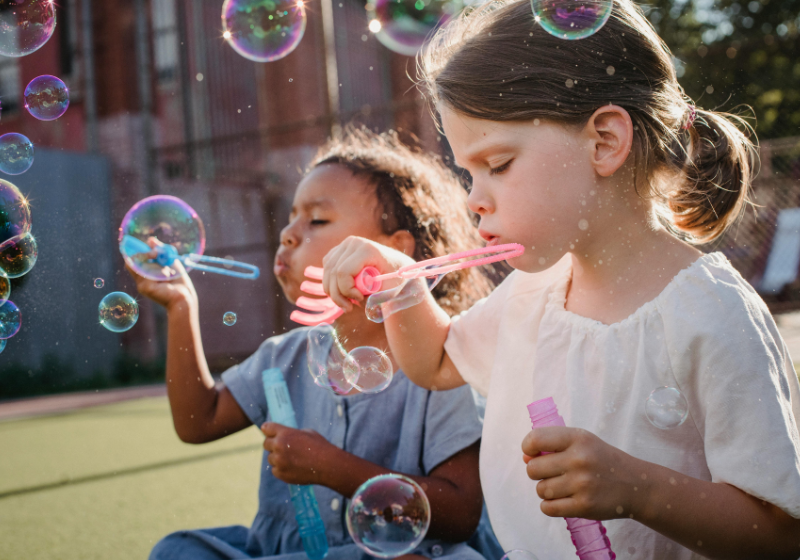 children blowing bubbles