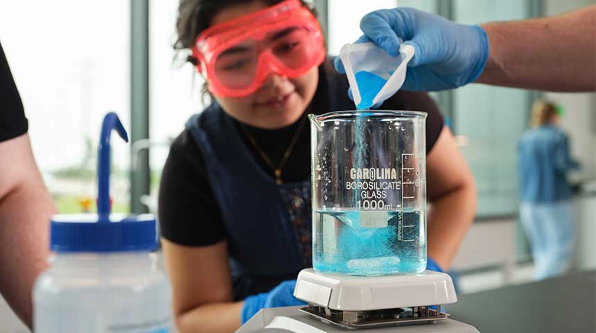 Pouring mixture in a high school science class